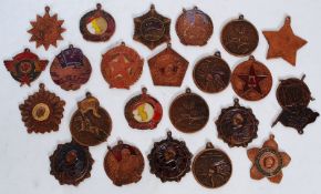 A collection of 23 bronze / copper enamel medals from China, Russia and Mongolia.