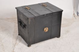 An early 20th century metal coal box / bucket having hinged lid with fleur de lys mounts. 38cms High