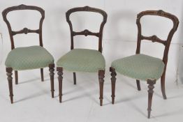 A set of 3 early Victorian mahogany kidney back / balloon back dining chairs. Raised on turned and