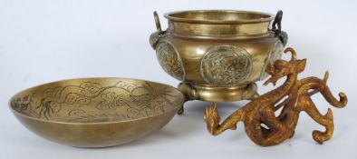 A large Chinese brass censur together with a chase decorated bowl and a brass dragon