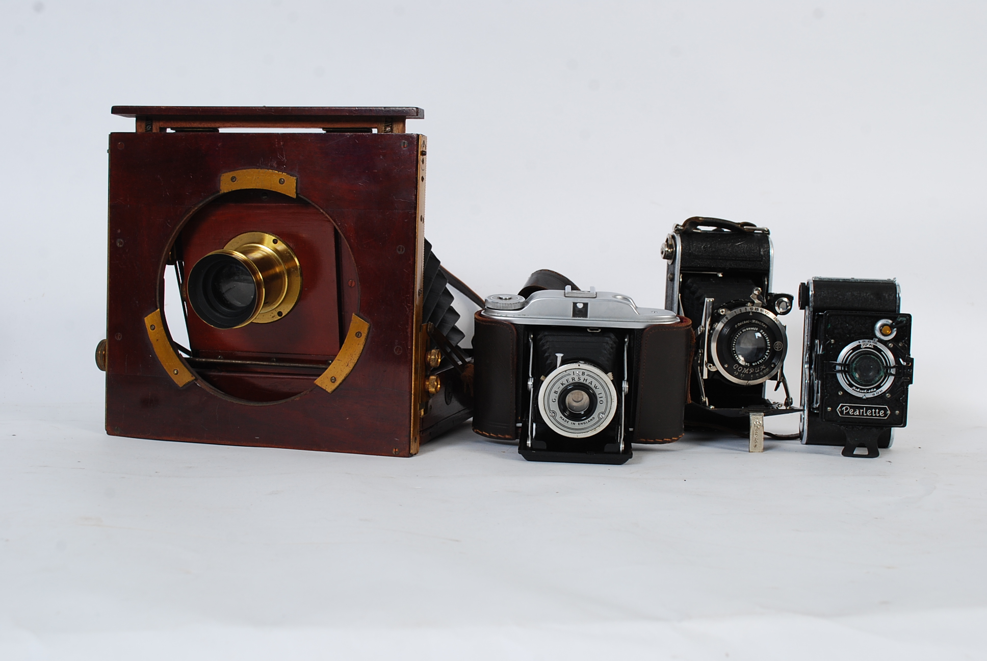 A W B & Sons Ltd box concertina camera with small plaque attached " The National Camera " along with