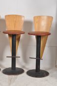 A set of 4 1970's faux crocodile skin upholstered bar stools. Cast metal bases and stems with foot