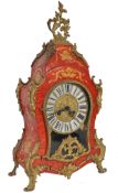An early 20th century French mantel clock, with faux tortoiseshell and boulle marquetry front. The