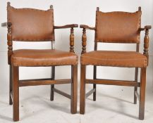 A pair of 1920's solid oak carver dining chairs. Squared legs united by stretchers having rexxine