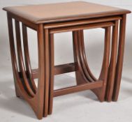 A retro 1970's G-Plan teak wood nest of tables. The graduating tables with crossbanded tops over