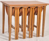 A 1970's retro teak wood Danish influence Quartetto teak retro tables. 53cms x 62cms x 42cms