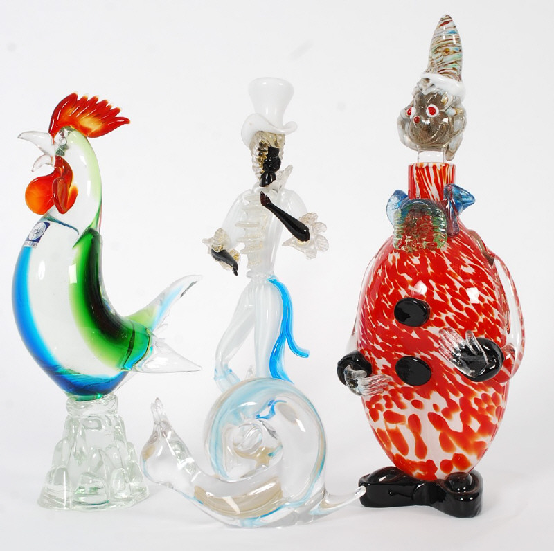 A Murano glass clown decanter, along with a Murano cockerel, a Murano figure of a dandy gent and a