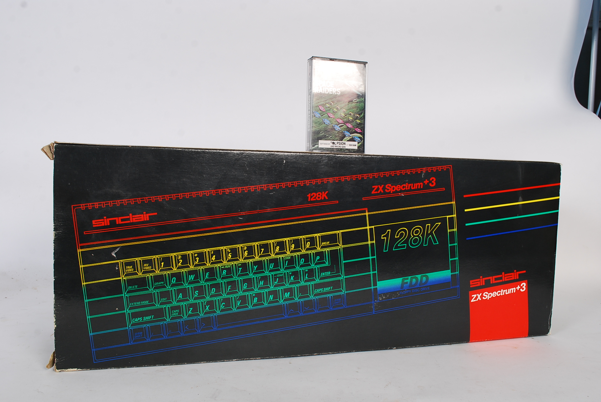 A retro ZX Spectrum computer gaming console and a 3 Sinclair 128k with original Space Raiders game.
