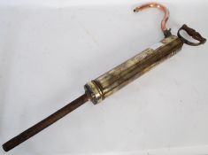 A Shand & Mason 1914 brass fire pump / hand pump having handle atop with polished cylindrical body