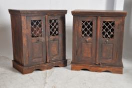 A pair of Hardwood Arabic style hardwood bedside cabinets. Raised on backet feet with decorative