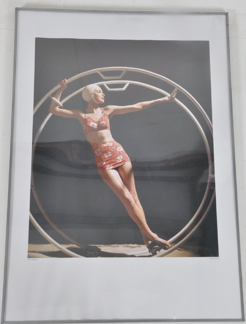 A John Rawlings framed photograph (poster size) of an Art Deco lady. Complete in frame, signed to