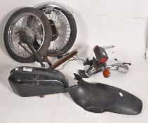A collection of vintage motorcycle parts, possibly a fizzy to include fuel tank, rear lights and