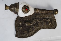 A 19th century Tibetan Conch horn with repousse white metal mounts decorated with Buddhist