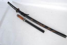 An oriental Japanese decorative sword in scabbard along with one other.