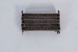 A triple medal bar from the early 20th century having bars for South Africa 1901, South Africa