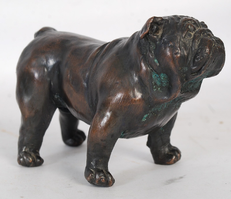 A cold cast bronze painted figurine of a bulldog. Stamped with impressed mark of dog to underside.