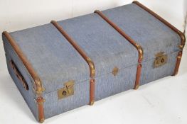 A good 1920's canvas and metal bound steamer trunk, clasps to front, ideal as coffee table. Measures