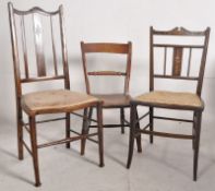 An Edwardian marquetry inlaid bedroom chair together with another mahogany bedroom chair with a