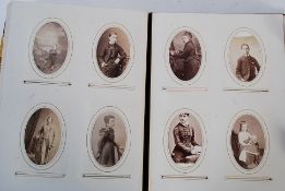 A Victorian cabinet photo album filled with photographs to include portraits, group photos and