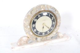 A vintage Art Deco style marble mantel clock with circular design to face and sides. Face marked for