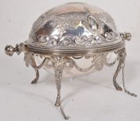 An Edwardian silver plate revolving breakfast dish by Martin Hall & Co of Sheffield, England. Rams