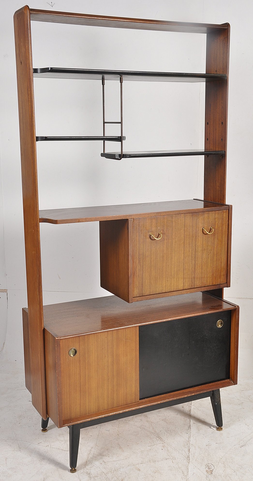 A 1960's original  G-Plan tola wood bookcase / room divider.Standing on tapered legs, with two