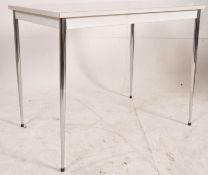 A 1970's retro formica and chrome kitchen dining table. Raised on turned and tapering chrome legs