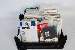 A large collection of first day covers / stamps presentation packs some in the original wrappings