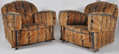 A pair of 1930's Art Deco cloud back armchairs complete in the original fabric. Measures 83cms