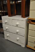 A Victorian painted cottage chest of drawers. 2 short drawers over 2 deep drawers being later