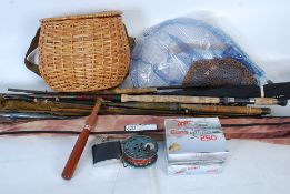 A selection of fishing rods to include fly fishing, sea fishing and other rods.
