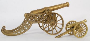 Two brass desk top cannons, the largest being 43cm long.