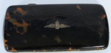 A tortoiseshell cigarette case with inset RAF emblem.