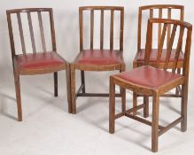 A set of 4 1930's Art Deco oak rail back dining chairs. Sqaure legs with stretchers having red