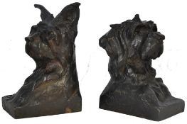 Maximilien-Louis Fiot, French, 1886-1953 Two bronze studies of dogs in the form of bookends, signed: