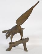 A large metal sculpture of an eagle on a branch approx 46cm high.