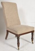 A 19th century William IV open armchair. Raised on reeded tapered mahogany legs with original