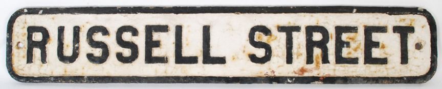 An original cast iron road sign from the city of Bristol. Black border with 'Russell Street' to