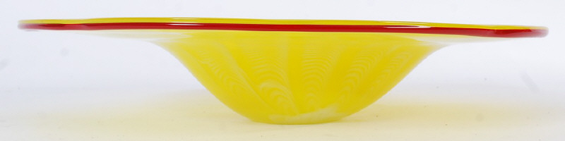 A large irridescent studio glass fruit bowl of good proportions in yellow and red