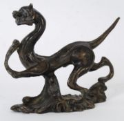 An 18th century oriental Chinese bronze study of a small dragon. 10cm in length.