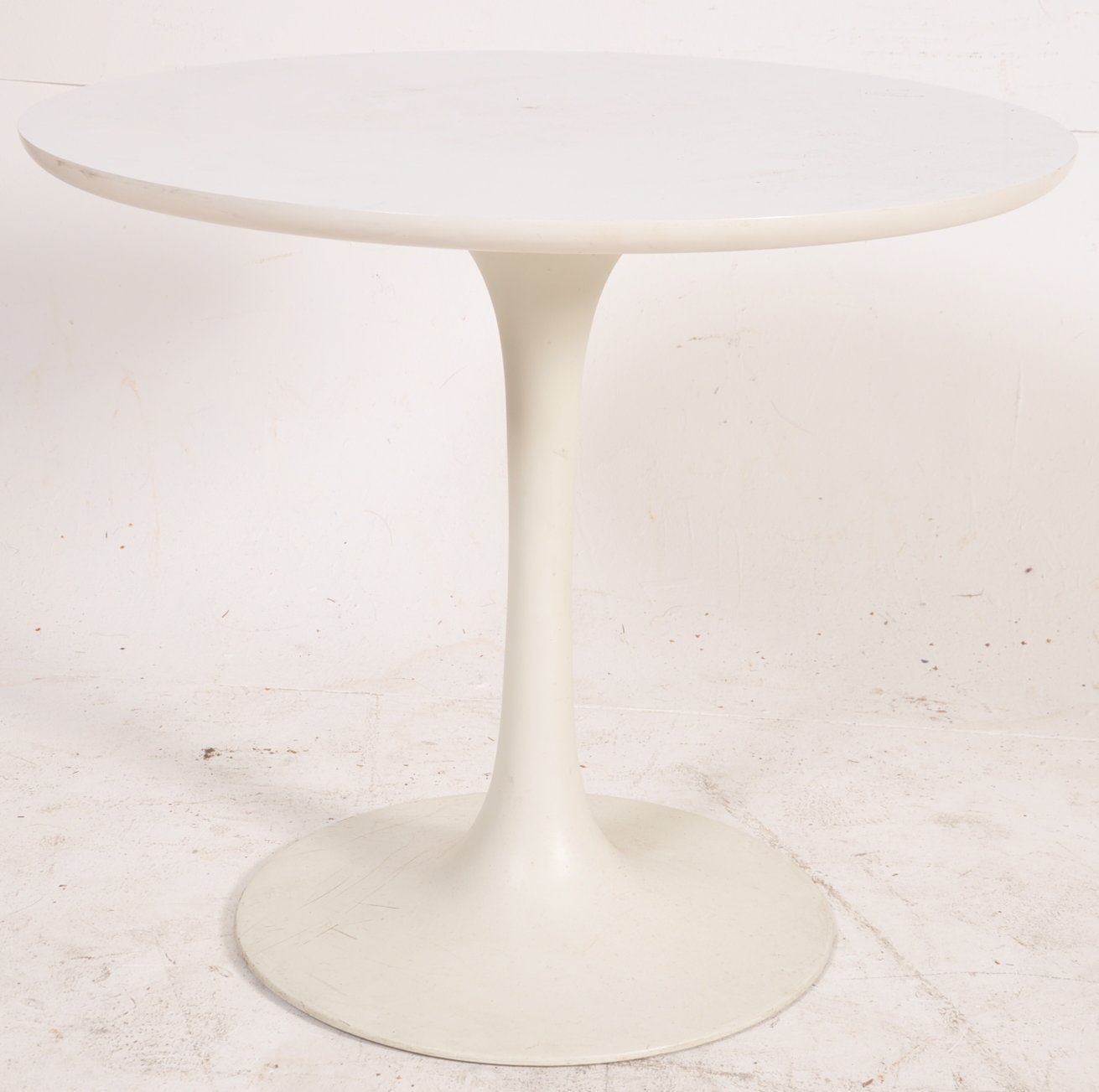 Arkana - A small white laminated `tulip` occasional table, cast mark to the loaded base, 44cm in
