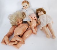 An assortment of vintage 20th century chidrens toy dolls to include nodding example and others.