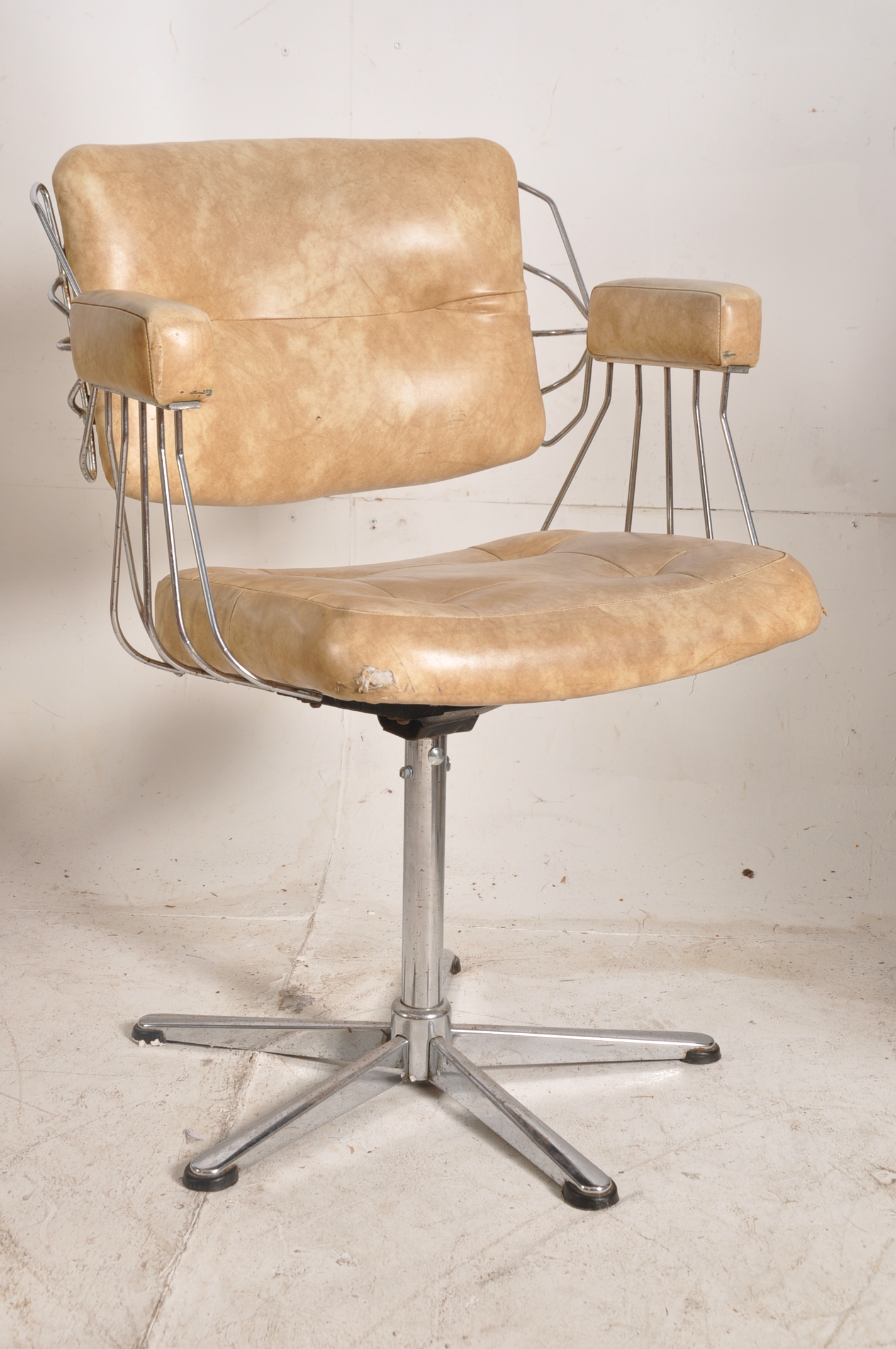 A Harry Bertoia style american wire work chair. Chrome base having original vinyl frame with elbow