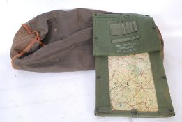 An original WWII military army tank canvas sleeping bag along with an original tank commanders map