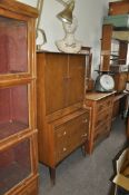 An unusual 1960's teak Danish influence bedroom dressing table. Raised on tapered supports having