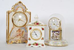 A Royal Albert Old Country Roses china clock 16cm tall, along with a china  Bradford Exchange
