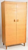 An original Gordon Russell oak Art Deco wardrobe, The angled legs supporting an upright body