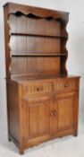A good Jaycee oak dresser in the Jacobean style. The base with cupboards and 2 short drawers with