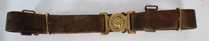 A British brass infantry leather belt and buckle “ Dieu et Mon Droit ” with Victorian crown