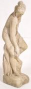 A large reconstituted stone garden ornament in the form of a classical nude female. 94cm tall.